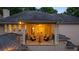 Charming balcony with stone flooring, comfortable seating, and bright lighting, perfect for relaxation at 8109 Lawnview, Alpharetta, GA 30022