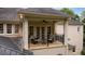Charming balcony with seating, offering a relaxing outdoor space with brick accents at 8109 Lawnview, Alpharetta, GA 30022