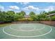 Community basketball court offers residents a convenient recreational space with a well-maintained court and natural surroundings at 8109 Lawnview, Alpharetta, GA 30022