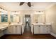 Spacious bathroom with dual sinks, granite countertops, custom cabinets, and wood flooring at 8109 Lawnview, Alpharetta, GA 30022