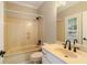 Bathroom featuring a shower/tub combo, single sink vanity, and tiled flooring at 8109 Lawnview, Alpharetta, GA 30022