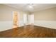 Bedroom with hardwood floors and wainscoting leading into an ensuite bathroom at 8109 Lawnview, Alpharetta, GA 30022