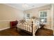 Charming bedroom with wood floors, large windows and ample natural light at 8109 Lawnview, Alpharetta, GA 30022
