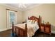 Cozy bedroom with a dark wood furniture set, ceiling fan and dark hardwood flooring at 8109 Lawnview, Alpharetta, GA 30022