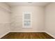 Empty walk in closet with wood floor and wire shelving at 8109 Lawnview, Alpharetta, GA 30022