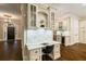 Hallway desk nook with marble counter, custom cabinets, and bar area at 8109 Lawnview, Alpharetta, GA 30022