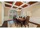 Elegant dining room featuring a coffered ceiling, chandelier, and wainscoting at 8109 Lawnview, Alpharetta, GA 30022