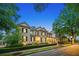 Elegant two-story home showcasing manicured landscaping and classic architectural details at 8109 Lawnview, Alpharetta, GA 30022