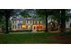 Beautiful home with lush front lawn and mature trees surrounding the property at 8109 Lawnview, Alpharetta, GA 30022