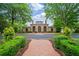 Club house with beautiful brickwork, grand arched entryways and manicured green landscaping at 8109 Lawnview, Alpharetta, GA 30022