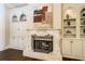 Close up on the fireplace with art and storage on either side at 8109 Lawnview, Alpharetta, GA 30022