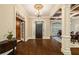 Gracious foyer featuring hardwood floors, elegant lighting, and an open floor plan at 8109 Lawnview, Alpharetta, GA 30022