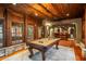 Spacious game room featuring a pool table, a bar area, and hardwood floors, perfect for entertaining and relaxation at 8109 Lawnview, Alpharetta, GA 30022