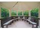 Charming gazebo with built-in seating, offering a cozy and shaded relaxation spot at 8109 Lawnview, Alpharetta, GA 30022