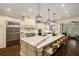 Gourmet kitchen featuring an oversized island with seating and stainless steel appliances at 8109 Lawnview, Alpharetta, GA 30022