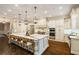 Gourmet kitchen featuring stainless steel appliances and an oversized island with seating at 8109 Lawnview, Alpharetta, GA 30022