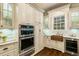 Gourmet kitchen with built-in stainless steel appliances and custom cabinetry at 8109 Lawnview, Alpharetta, GA 30022