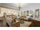 Spacious living room connects to an eat-in kitchen with ample seating and natural light at 8109 Lawnview, Alpharetta, GA 30022
