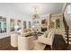 Bright and airy living room with large windows, fireplace, and hardwood floors at 8109 Lawnview, Alpharetta, GA 30022