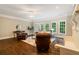 Spacious living room featuring hardwood floors, recessed lighting, and a decorative fireplace at 8109 Lawnview, Alpharetta, GA 30022