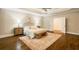 Charming main bedroom boasts hardwood floors, tray ceilings, a sitting area, and neutral paint at 8109 Lawnview, Alpharetta, GA 30022