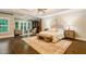 Spacious main bedroom with sitting area, tray ceiling, and access to the backyard at 8109 Lawnview, Alpharetta, GA 30022