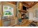 Covered outdoor kitchen with grill and fireplace at 8109 Lawnview, Alpharetta, GA 30022