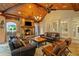 Relaxing outdoor living space with a stone fireplace, grill, and ample seating at 8109 Lawnview, Alpharetta, GA 30022