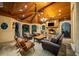 Inviting outdoor living area featuring a stone fireplace, grill, and comfortable seating at 8109 Lawnview, Alpharetta, GA 30022