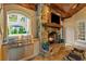 Outdoor kitchen space featuring a stone fireplace and grill at 8109 Lawnview, Alpharetta, GA 30022