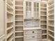 Walk-in pantry with custom shelves and drawers for maximum storage at 8109 Lawnview, Alpharetta, GA 30022