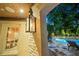 Covered outdoor patio featuring a view of a pool and spa with stone surroundings at 8109 Lawnview, Alpharetta, GA 30022