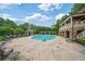 Stunning pool area with plenty of lounge chairs, umbrellas and covered seating, perfect for relaxing and entertaining at 8109 Lawnview, Alpharetta, GA 30022