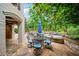 Relax by the pool on a beautiful stone patio with outdoor seating at 8109 Lawnview, Alpharetta, GA 30022