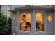 Charming outdoor living space with fireplace, cozy seating, and elegant design, perfect for entertaining at 8109 Lawnview, Alpharetta, GA 30022