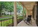 Relaxing front porch with stately columns and charming rocking chairs at 8109 Lawnview, Alpharetta, GA 30022