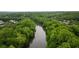 Aerial view of a river surrounded by dense green trees and luxurious homes at 8109 Lawnview, Alpharetta, GA 30022