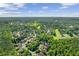 Beautiful aerial shot of the neighborhood with green space, a golf course, and a pond at 8745 Islesworth Ct, Duluth, GA 30097