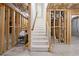 Unfinished basement with staircase access, ready for customization and additional living space at 8745 Islesworth Ct, Duluth, GA 30097