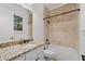 Bathroom featuring granite countertops and built in tub at 8745 Islesworth Ct, Duluth, GA 30097