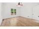 Cozy bedroom with neutral paint and hardwood floors at 8745 Islesworth Ct, Duluth, GA 30097