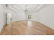 Bright bedroom featuring hardwood floors and elegant lighting at 8745 Islesworth Ct, Duluth, GA 30097