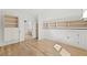 A walk-in closet with custom built-ins and hardwood floors, offering ample storage space at 8745 Islesworth Ct, Duluth, GA 30097