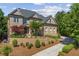 A charming brick home with a well-manicured front yard and landscaped driveway at 8745 Islesworth Ct, Duluth, GA 30097