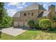 Rear exterior of house showing the attached three car garage at 8745 Islesworth Ct, Duluth, GA 30097
