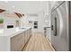 Bright kitchen with a large island, stainless appliances, and a fireplace at 8745 Islesworth Ct, Duluth, GA 30097