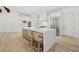 Bright kitchen features a large island with bar stools and stainless appliances at 8745 Islesworth Ct, Duluth, GA 30097