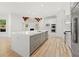 Bright kitchen features a large island, stainless appliances, and modern design at 8745 Islesworth Ct, Duluth, GA 30097