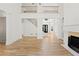 Bright living room with a fireplace, hardwood floors and a staircase at 8745 Islesworth Ct, Duluth, GA 30097