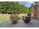 Back patio with outdoor furniture and well maintained landscaping at 8745 Islesworth Ct, Duluth, GA 30097